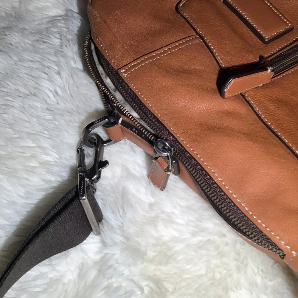 Tumi worn but